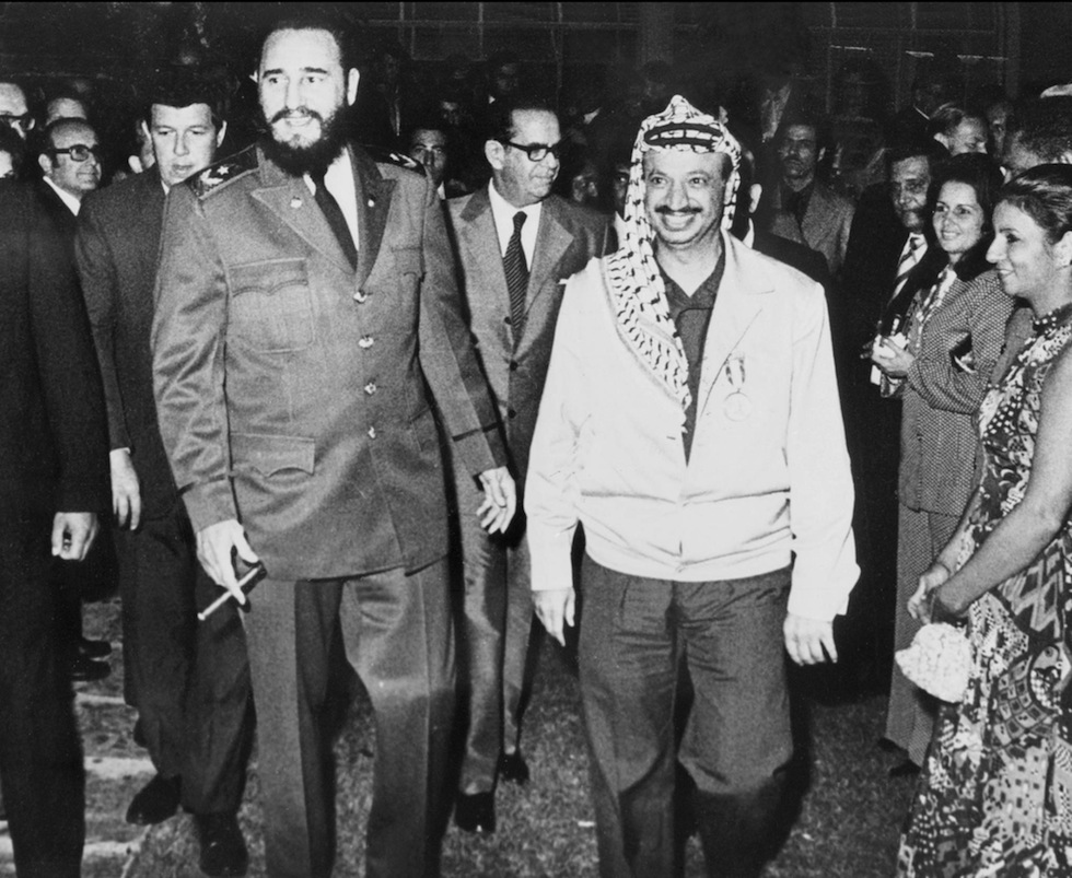 LA HABANA, CUBA - DECEMBER 14: The Palestine Liberation Organization (PLO) chairman Yasser Arafat (R) walks nearby Cuban leader Fidel Castro during his visit in Cuba in December 1974. Yasser Arafat found the Palestine Liberation Movement or Fatah in Kuwait in 1959 and gained control over the PLO in 1969. (Photo credit should read STF/AFP/Getty Images)