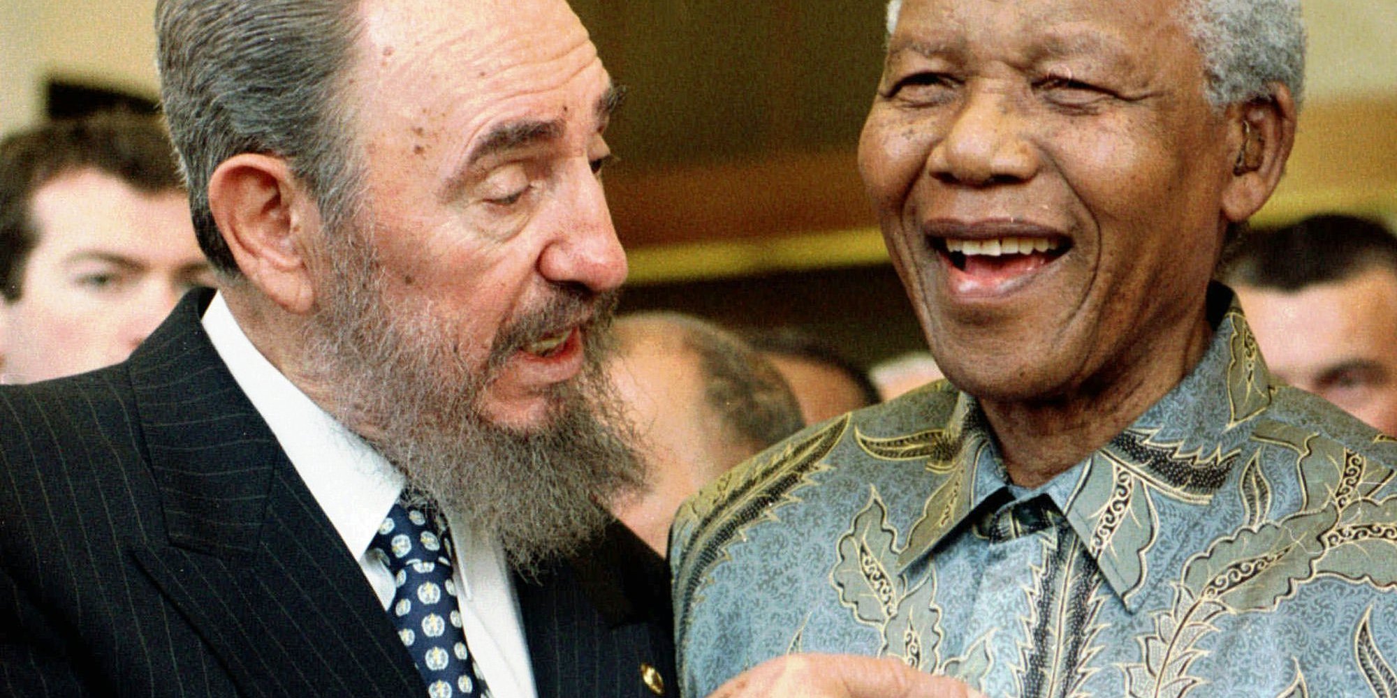 Cuban leader Fidel Castro, left, shares a laugh with South Africa President Nelson Mandela at the World Trade Organization held in Geneva Tuesday, May 19, 1998. Mandela and Castro said in separate speeches that the global trading system had failed to achieve its goals of bringing a higher standard of living to many developing countries. (AP Photo/PATRICK AVIOLAT)