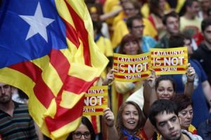 Separatist protesters hold up placards as they demonstrate during "Diada de Catalunya" (Catalunya's National Day) in central Barcelona, September 11, 2013. REUTERS/Albert Gea